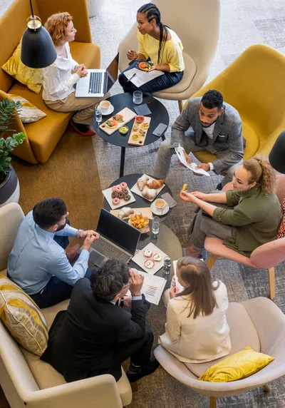 Business people having a brunch meeting Business people having a brunch meeting